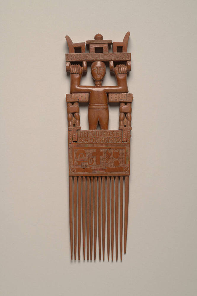 Comb with Figure Holding a Table and Chairs