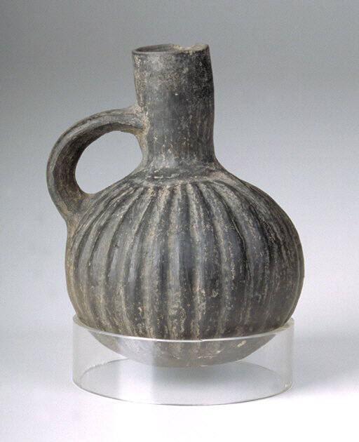 Vessel with spout and handle